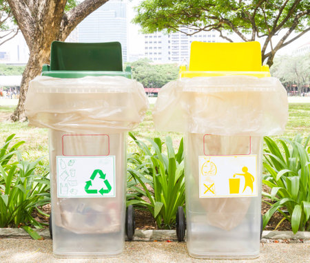 Green and yellow bins, Recycling bin and general binの写真素材