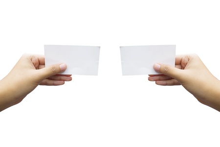 hand holding blank paper business card, closeup isolated over white background の写真素材