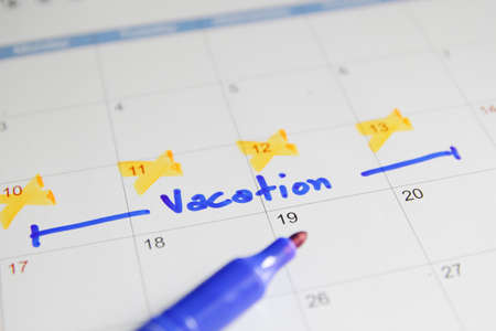 Vacation plan written on calendarの写真素材
