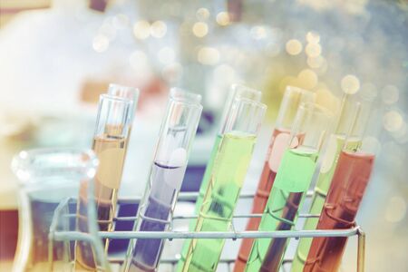 the laboratory test tubes with colorful liquid with soft focus