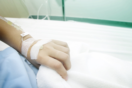 Close up saline IV drip for patient and Infusion pump in hospital.の写真素材