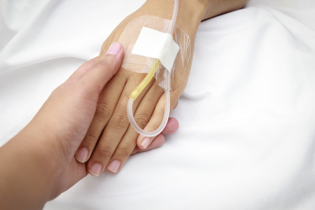 patient in hospital with saline intravenous (iv)の写真素材