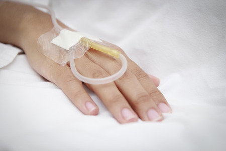 patient in hospital with saline intravenous (iv)の写真素材