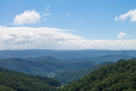 Green hills under impressive sky