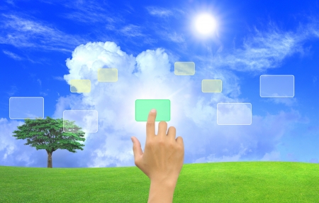hand pushing a button on a touch screen interfaceの写真素材