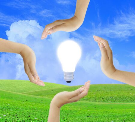 Women hand with light bulbの写真素材
