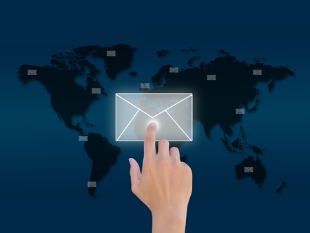 Hands with world mail delivery on world map background の写真素材