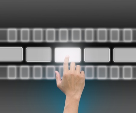 hand pushing a button on a touch screen interface の写真素材