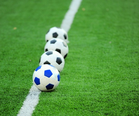 soccer ball on green grass の写真素材