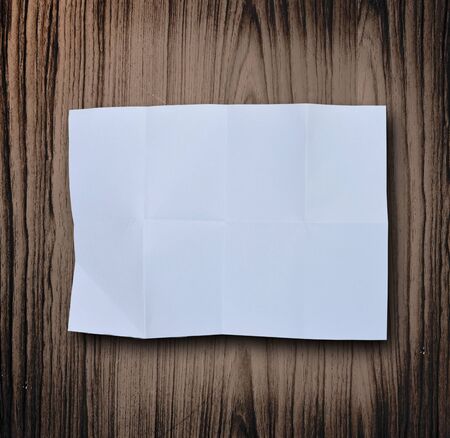paper on wood backgroundの写真素材