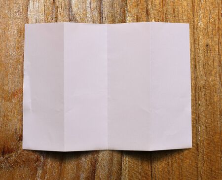 paper on wood backgroundの写真素材