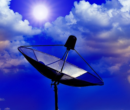 The dish antenna on blue skyの写真素材