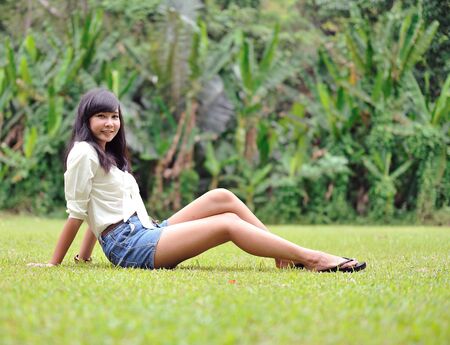 girl on green field の写真素材