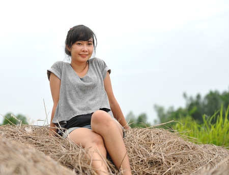 Portrait of beautiful girl in field の写真素材