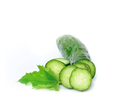 Cucumber and slices isolated over white background.の写真素材