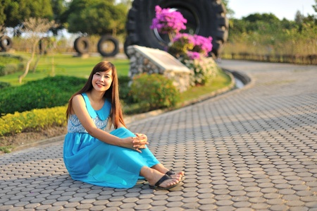 beautiful young girl in a meadow in summer の写真素材