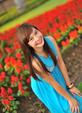 beautiful young girl in a meadow in summer の写真素材