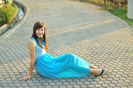 beautiful young girl in a meadow in summer の写真素材