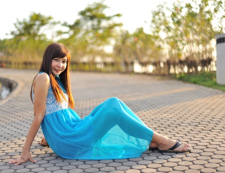 beautiful young girl in a meadow in summer の写真素材