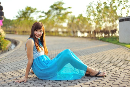 beautiful young girl in a meadow in summer の写真素材