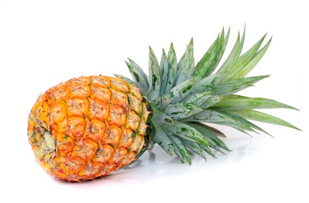 ripe pineapple isolated on white の写真素材