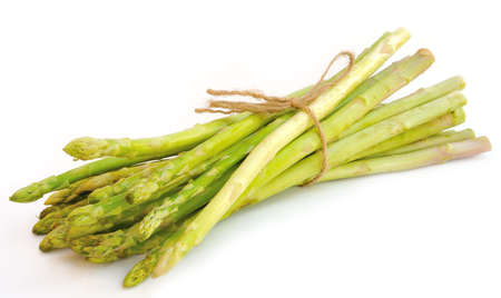 Bunch of fresh asparagus isolated on white background の写真素材