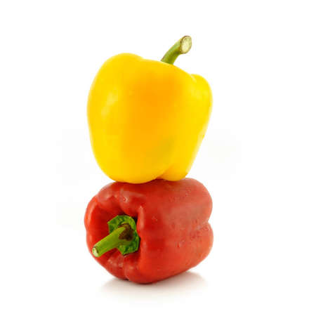 Red and yellow sweet pepper isolated on white backgroundの写真素材