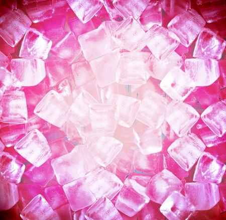 background with ice cubes in red lightの写真素材
