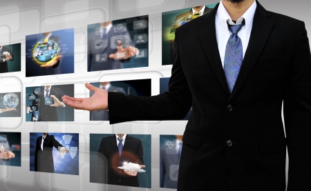businessman holding Reaching images streaming in hands  Financial and technologies conceptsの写真素材