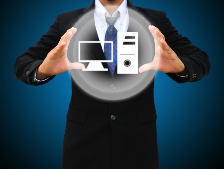 Business man holding computer iconの写真素材