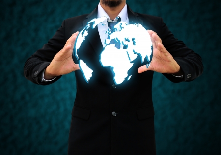 businessman  holding a worldの写真素材