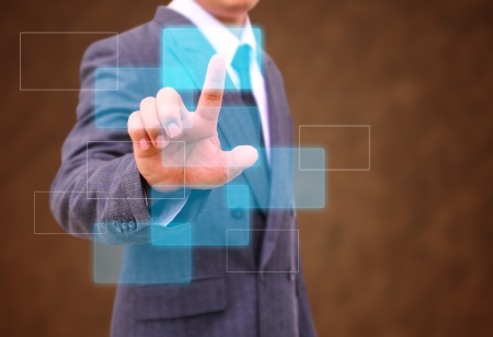 businessman hand pushing button on a touch screen interfaceの写真素材