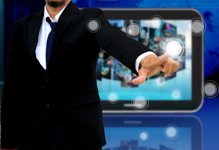 businessman holding a touch screen interfaceの写真素材