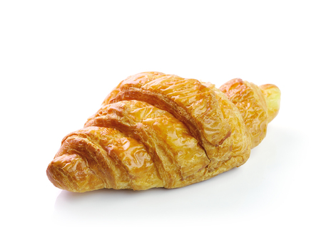 Fresh and tasty croissant over white backgroundの写真素材