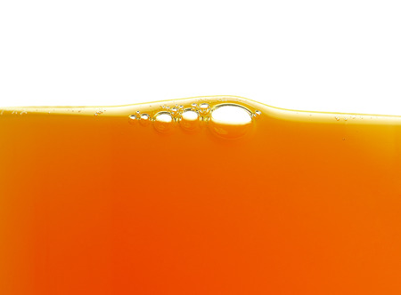 yellow bubbles in the orange juice