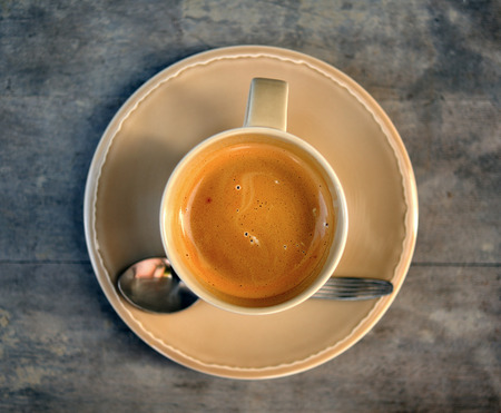 Cup of coffee on a wooden tableの写真素材