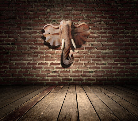 room interior vintage with brown textured wall and Elephant head carvingの写真素材