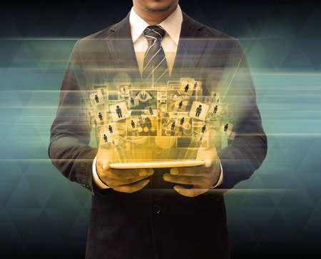 businessman holding tablet technology business conceptの写真素材