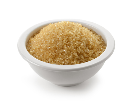 Sugar in bowl isolated on whiteの写真素材