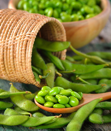 green soy beans in the wood bowl on tableの写真素材