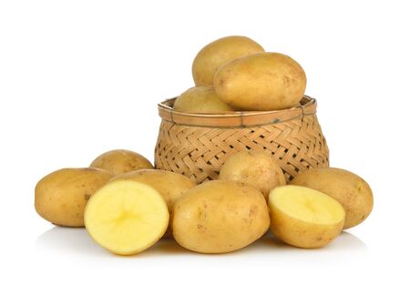 potato in the basket isolated on white backgroundの写真素材