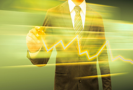 businessman hand drawing business graphの写真素材