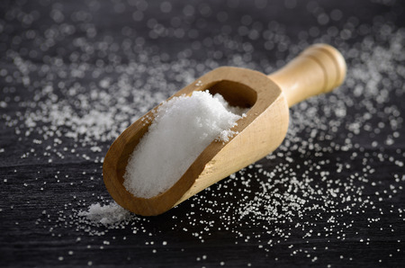 Salt in wood scoopの写真素材