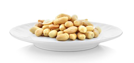 peanuts in white plate on white backgroundの写真素材
