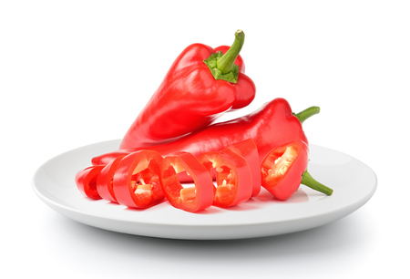 Sweet pepper in plate isolated on a white backgroundの写真素材