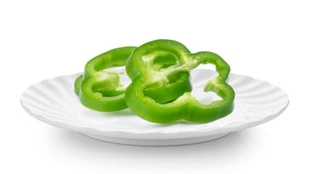 Sliced green pepper in plate on white backgroundの写真素材
