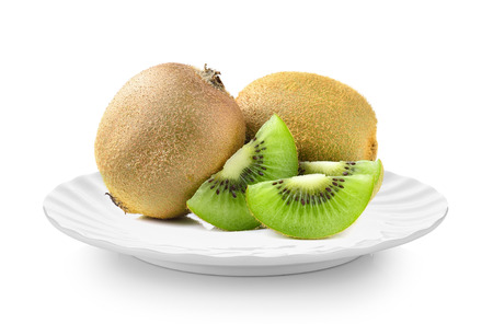 kiwi fruit in white plate on white backgroundの写真素材