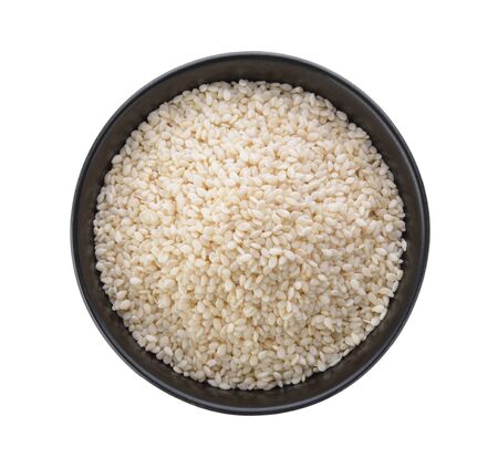 White sesame in a bowl on white backgroundの写真素材