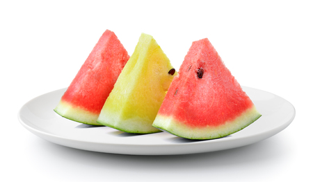 red yellow water melon in plate isolated on a white backgroundの写真素材