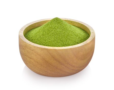 green tea powder in wood bowl on white backgroundの写真素材